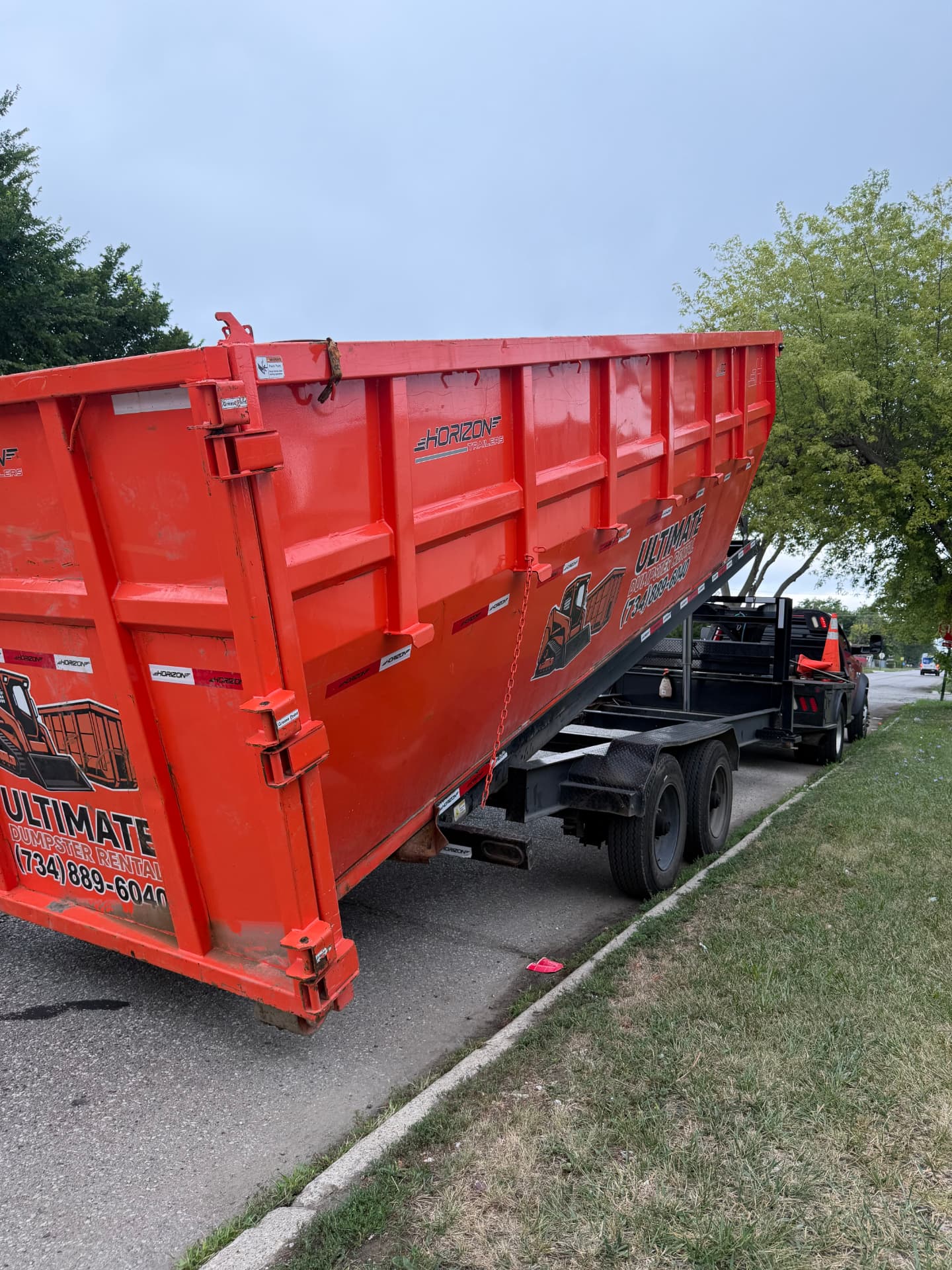 Ultimate Dumpster Rental 30 yard dumpster being delivered